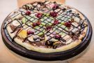 Pizza dolce con frutta e nutella Pizza dolce con frutta e nutella