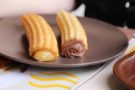 Dolci spagnoli, churros ripieni con cioccolato fondente Dolci spagnoli, churros ripieni con cioccolato fondente